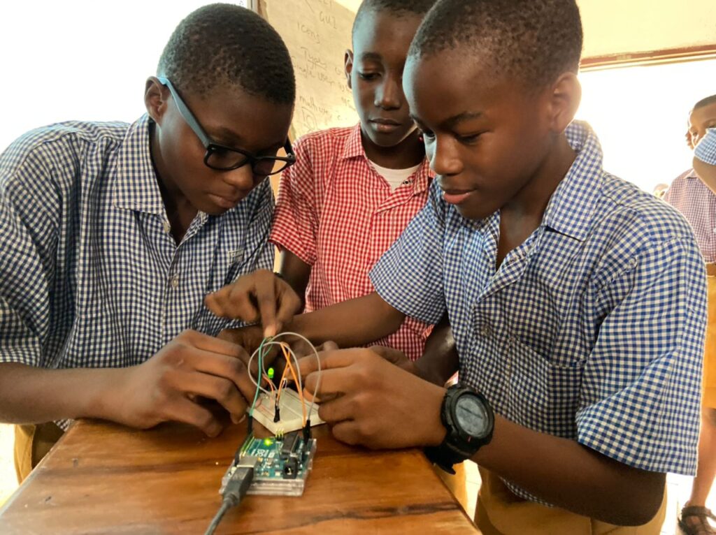 3 boys doing simple light circuit practicals